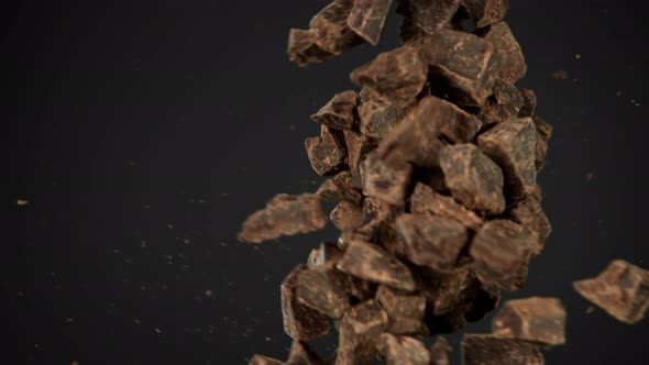 Super Slow Motion Shot of Raw Chocolate Chunks Side Crashing at 1000 Fps alt