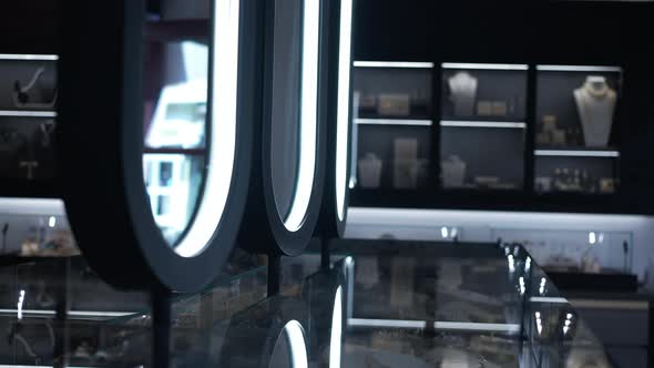 Mirrors in Luxurious Jewellery Shop with Accessories on Shelves Indoors alt