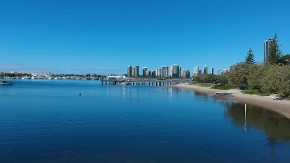Aerial view showing Australia's Gold Coast waterways and urban sprawl on a clear day alt