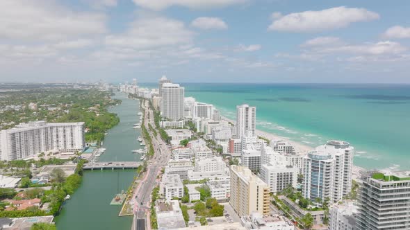 Fly Over Stripe of High Rise Buildings Along Sea Coast alt