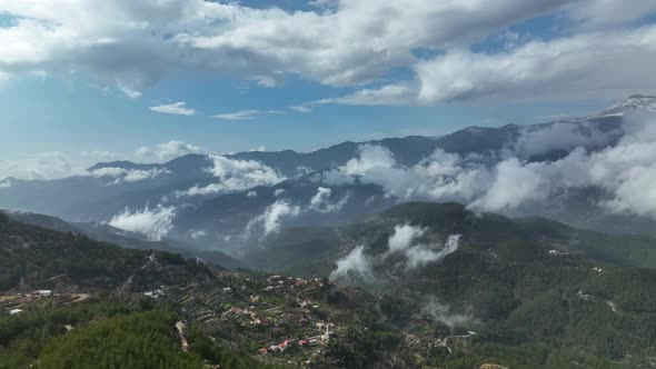 Cloudy landscape high in the mountains aerial view 4 K alt