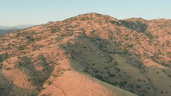 Aerial Drone Shot Ascending Over the Top of a Mountain to Reveal Hills (Lake Kaweah, Visalia, CA)