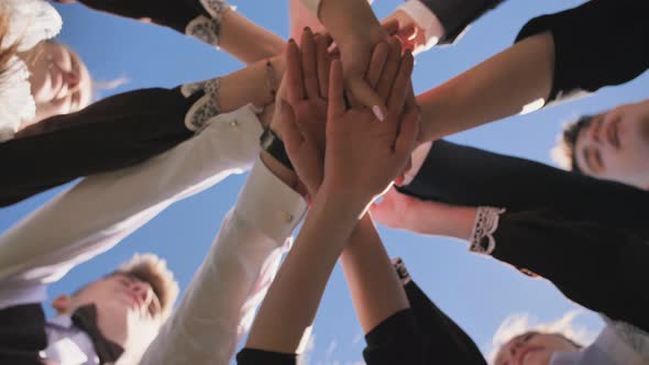 College Students Teamwork Stacking Hand Concept alt