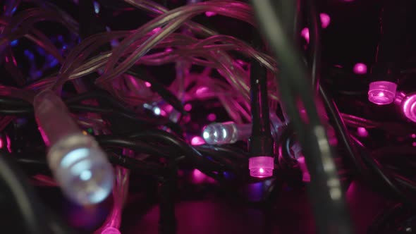 Motion Through Fairy Lights Pile Glowing Purple at Christmas alt