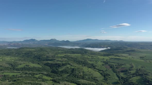 Morning fog  over foothills of Carpathian mountains in Serbia 4K aerial video alt