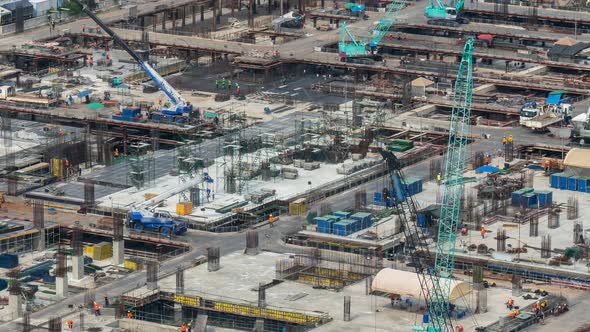 Time lapse of construction site with heavy construction machinery in metropolis alt