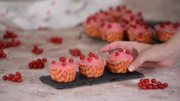 Tasty Muffins With Red Currants Berries And Sugar Glaze.