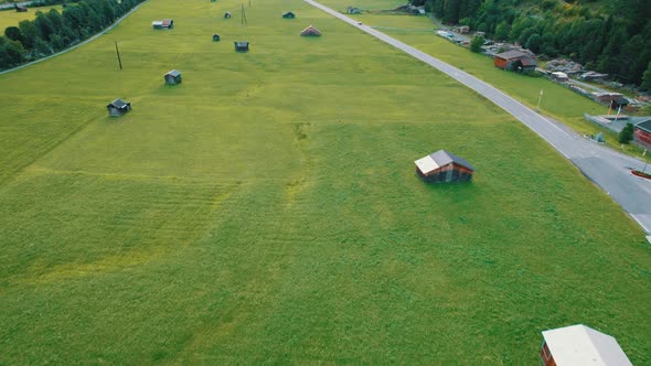 Road in Austria Between Green Fields In an Alpine Village Aerial View alt