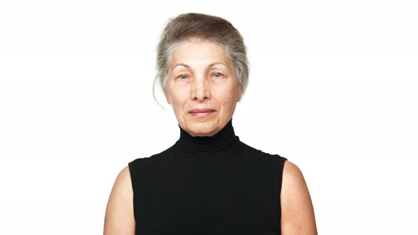 Picture of Adult Woman with White Tied Hair Looking at Camera Smiling Nodding Positively Over White alt