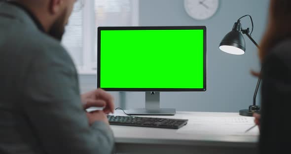 Business Colleagues Using Green Screen Pc