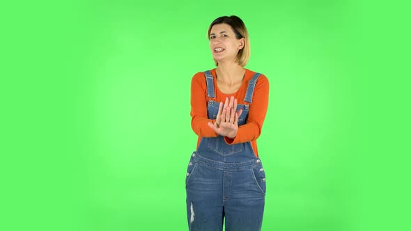 Woman Strictly Gesturing with Hands Shape Meaning Denial Saying NO. Green Screen alt