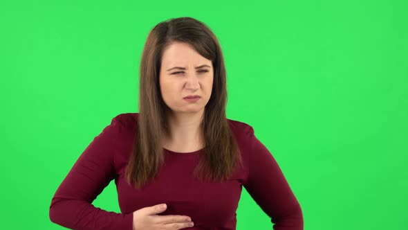 Portrait of Pretty Girl Goting a Cold, Green Screen alt