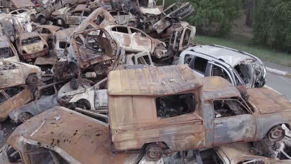 War in Ukraine a Dump of Burned Cars in Irpin Bucha District alt