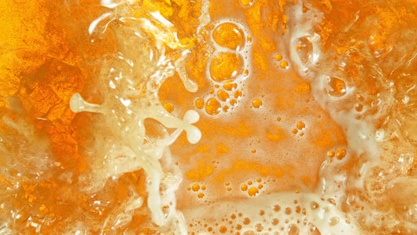 Super Slow Motion Shot of Rippling Fresh Beer Wave From Top Shot at 1000Fps alt
