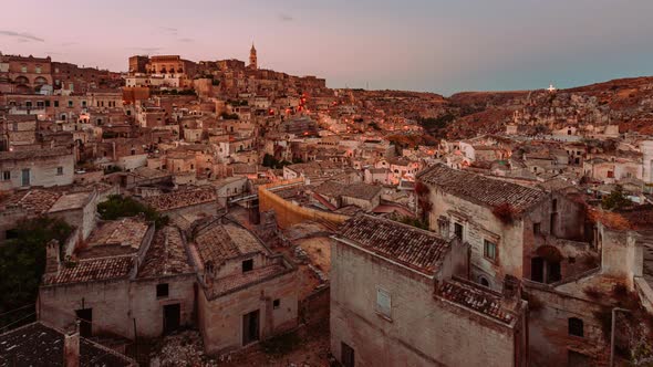 Sassi of Matera from sunset to night with illumination of the houses, Timelapse 4k alt