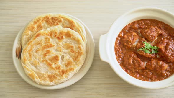 chicken tikka masala spicy curry meat food with roti or naan bread - Indian food style alt