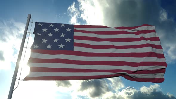 American Flag Flying in the Wind at Sunny Day alt
