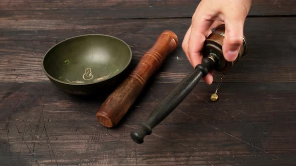 Tibetan singing copper bowl with a wooden clapper  alt