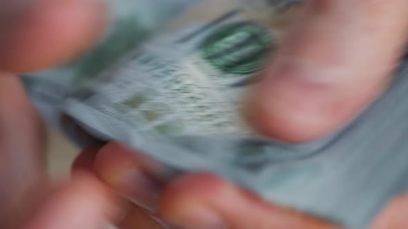 Hands Counting US Dollar Bills or Paying in Cash alt