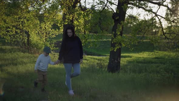 Mother and Son on a Walk in the Park alt