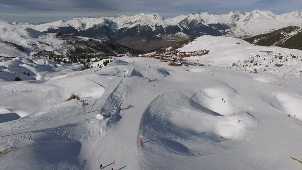Aerial view of people skiing at La Plagne ski resort alt
