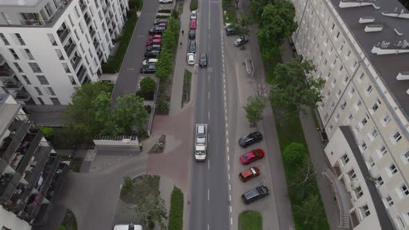 Aerial Drone Footage Tow Truck Drives a Car Down the Street