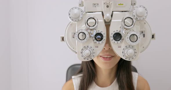young woman having eye test alt