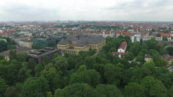 Aerial view of buildings near a park alt