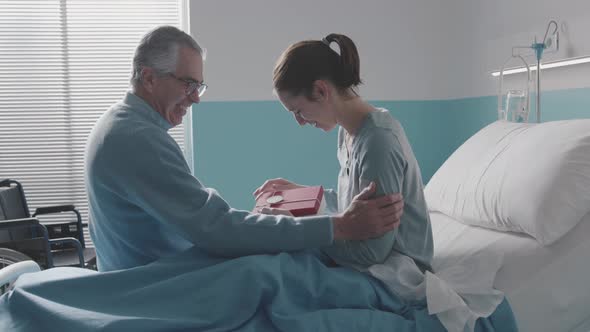 Father visiting her daughter at the hospital