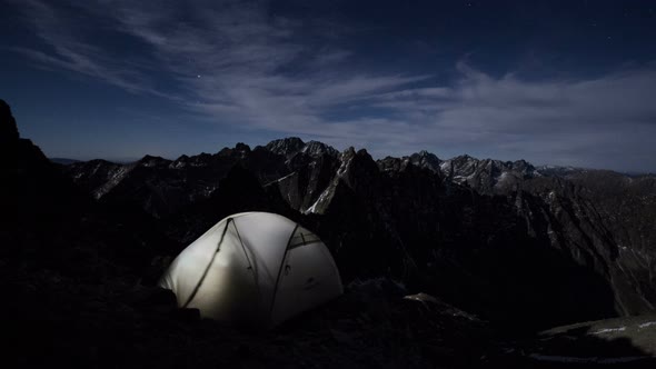Time Lapse Moon Illuminating Mountain Valley and Tent in Tatry, Slovakia