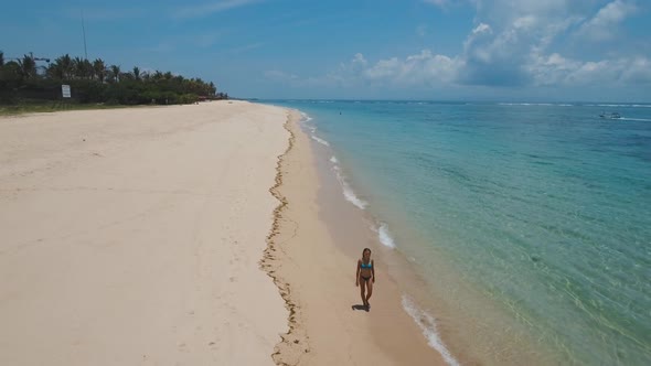 Girl Walking on the Beach alt