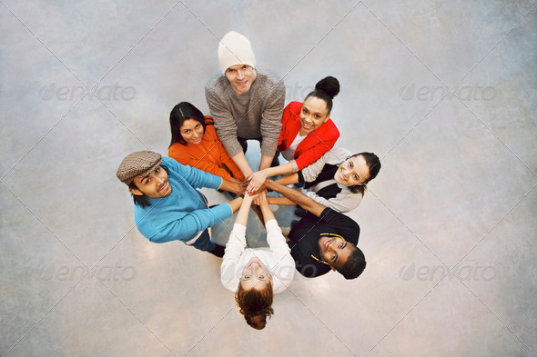 Happy young students showing unity as a team - Stock Photo - Images