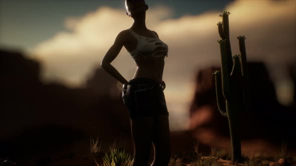 Woman in Torn Shirt Standing By Cactus in Desert at Sunset alt