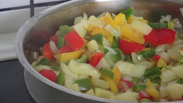 Sliced fresh vegetables in pan 
