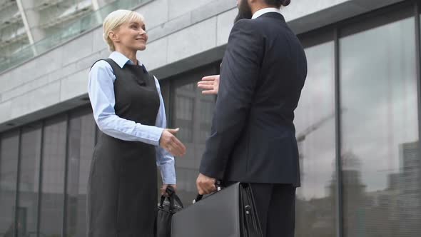 Male Office Head Shaking Hand With New Worker Outdoor, Greeting or Cooperation