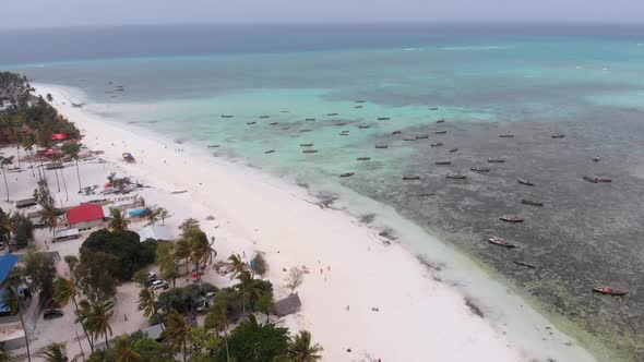 Lot Fishing Boats Stuck in Sand Off Coast at Low Tide Zanzibar Aerial View alt