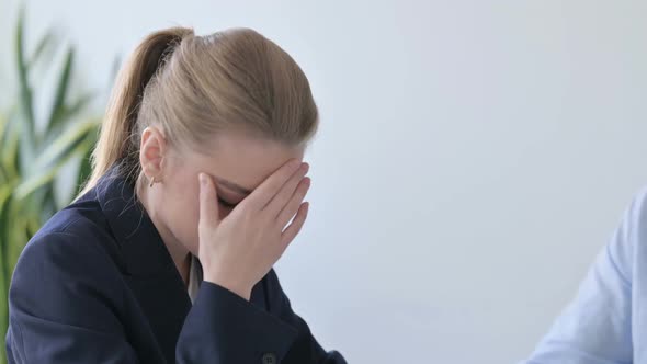 Close Up of Upset Businesswoman Being Scolded By Colleagues alt