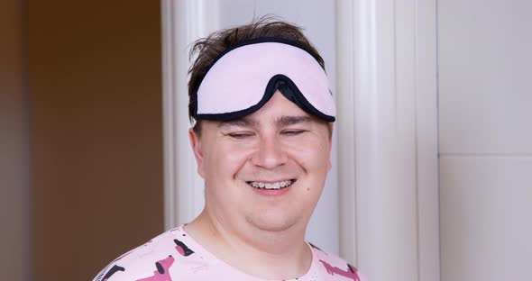 Plump Man with Blindfold on Forehead Walks to Bathroom