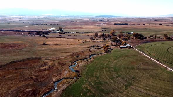 Aerial footage of the vast farmland countryside of southern Utah. alt