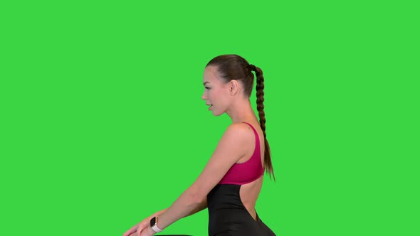 Fitness Woman Doing Lunges and Losing Balance on a Green Screen Chroma Key