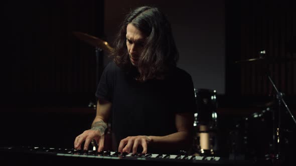 Sad Man Pianist Waving Hand in Music Studio. Upset Guy Pressing Keys Indoor. alt