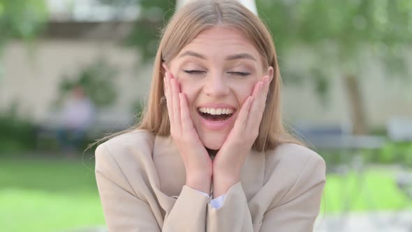 Outdoor Portrait of Young Businesswoman Feeling Surprised alt