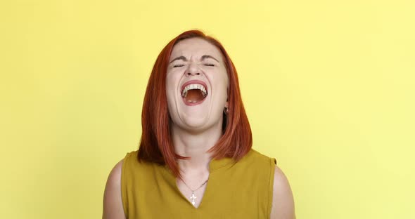 Beautiful Ginger Woman Screaming and Looking at Camera.