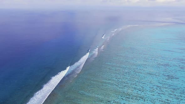 Maldive Reef with Turquoise Blue Water Aerial View