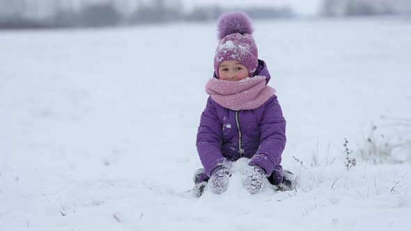 Cheerful child enjoying beautiful winter day.