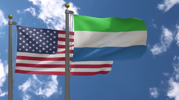 Usa Flag Vs Sierra Leone Flag On Flagpole alt