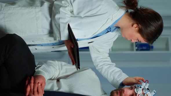Vertical Video Man Sitting on Neurological Chair with Brainwave Scanning Headset alt