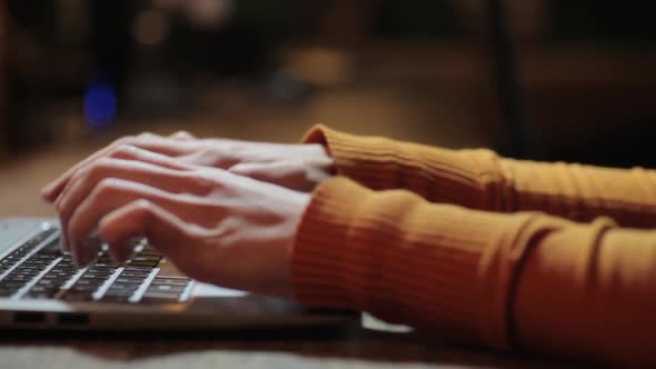 Woman's hands working on a laptop