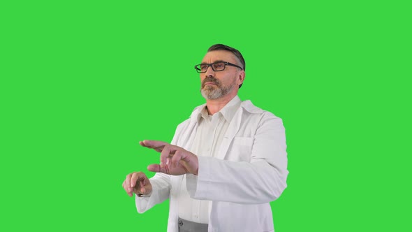 Doctor Scientist Looking and Using Virtual Touch Screen on a Green Screen Chroma Key alt