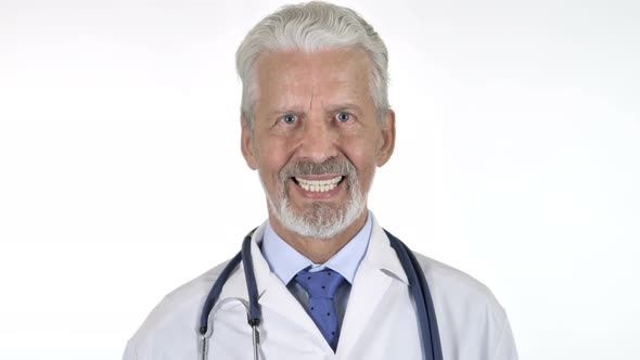 Portrait of Smiling Senior Doctor Isolated on White Background alt